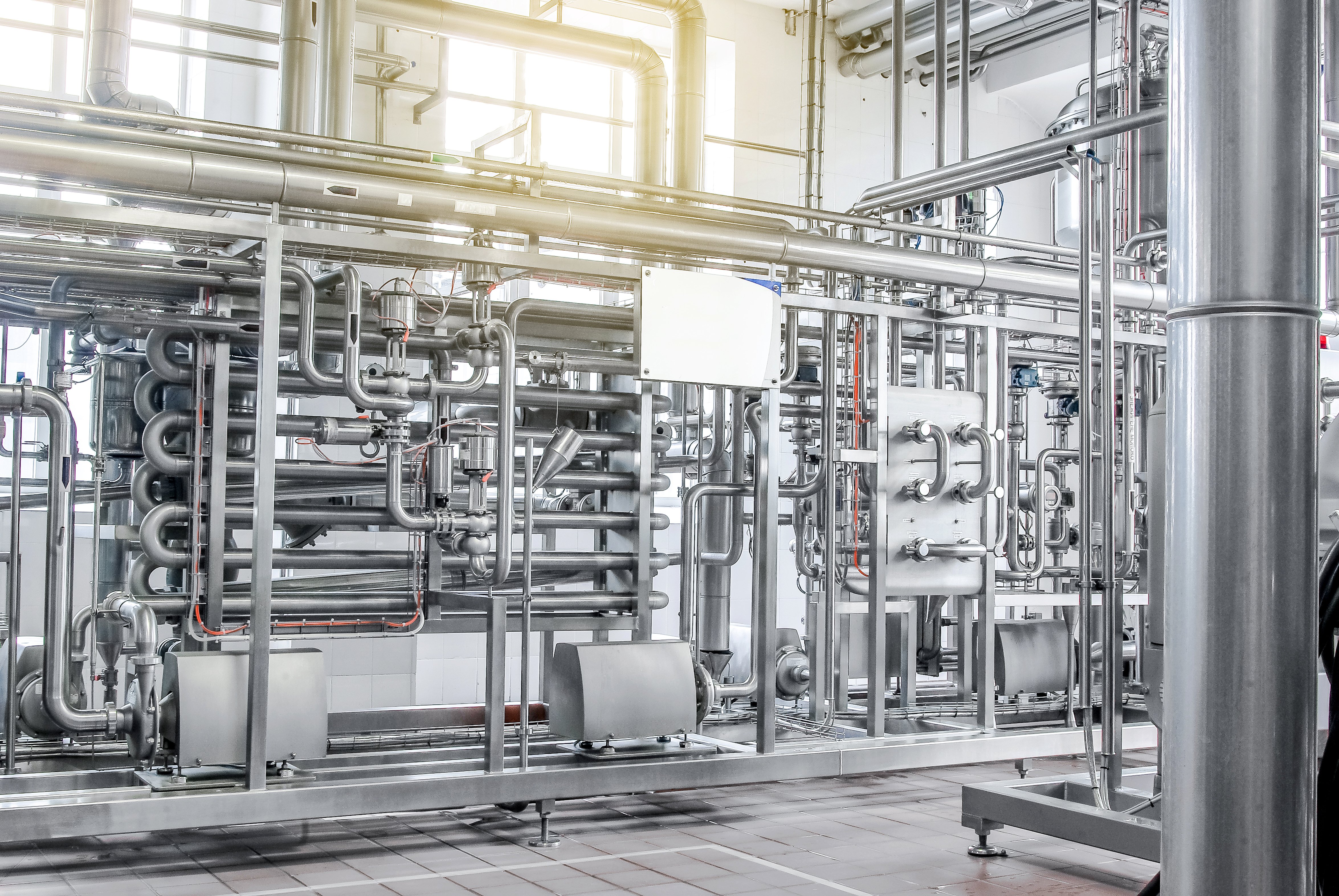 Process lines and tanks in a dairy and beverage plant