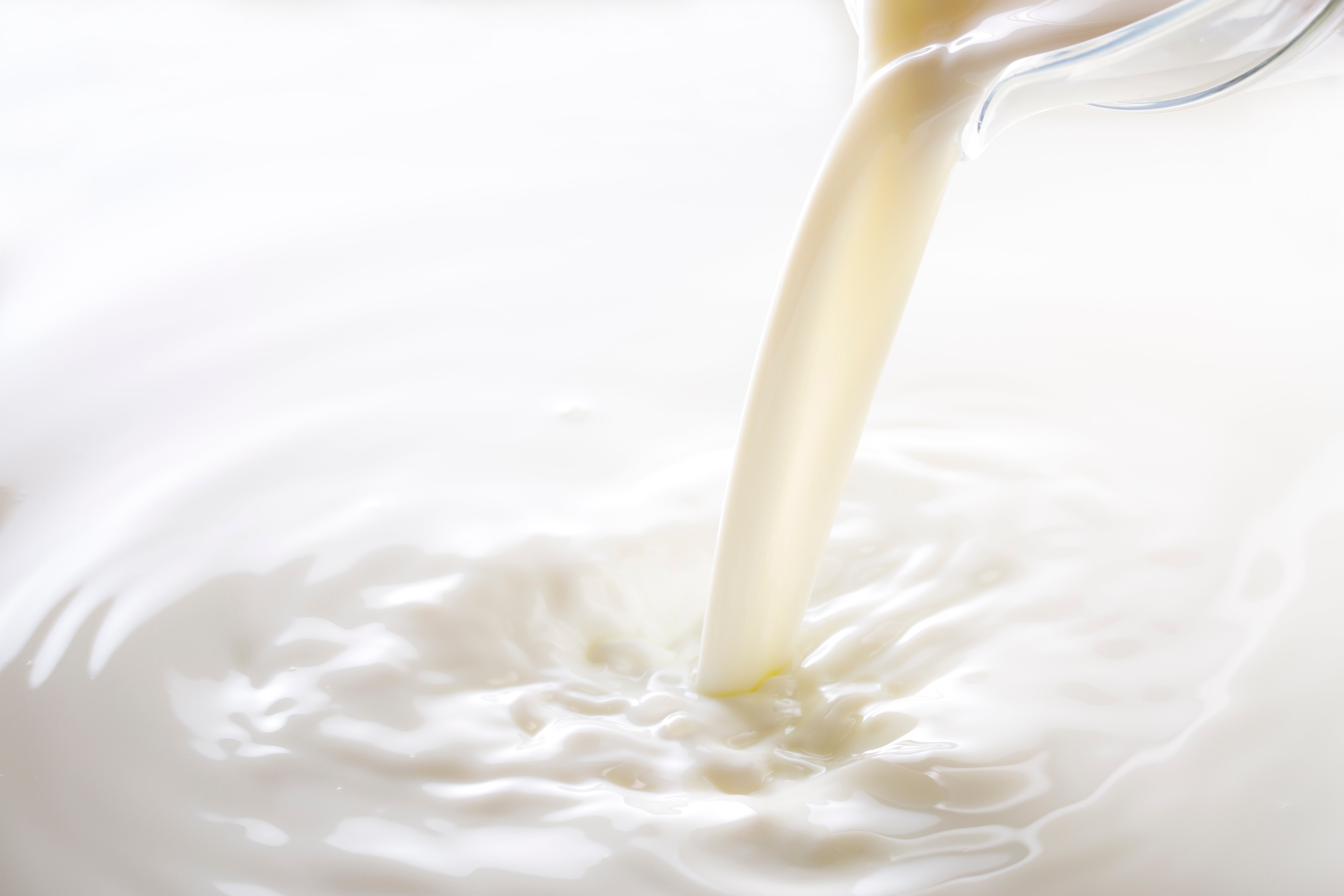 Milk pouring down - iStock-627000410