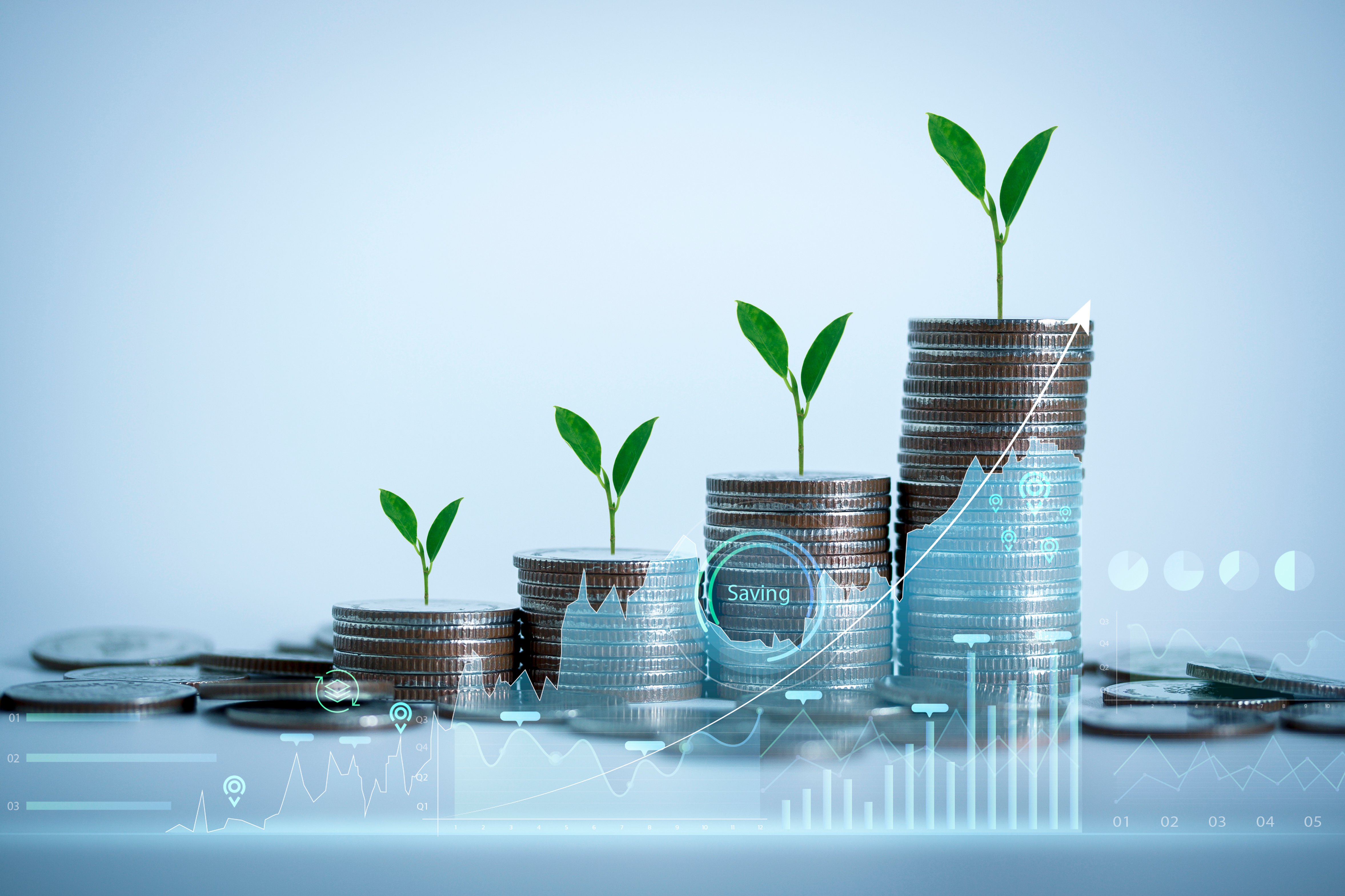 Coin stacks with abstract financial illustration - iStock-1356984435