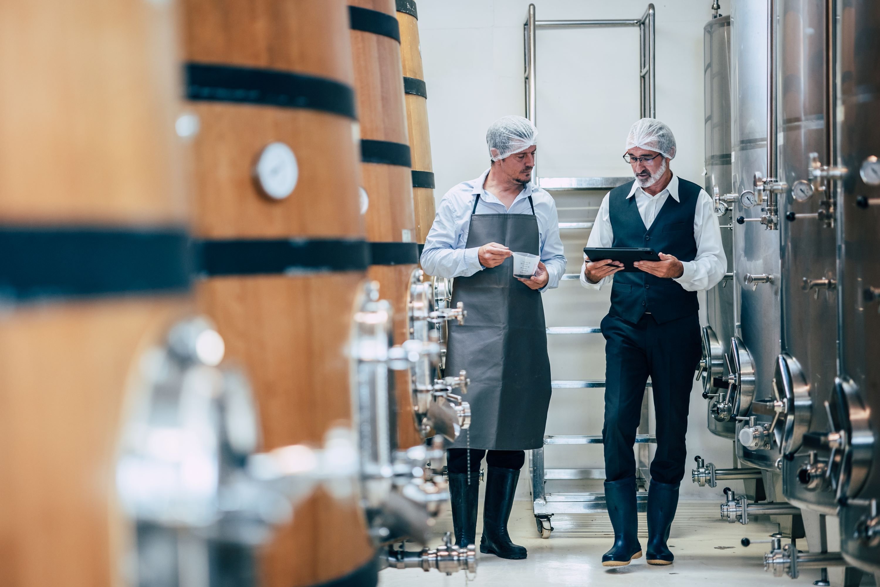 Winemakers in modern winery - AdobeStock_586505059_3000px